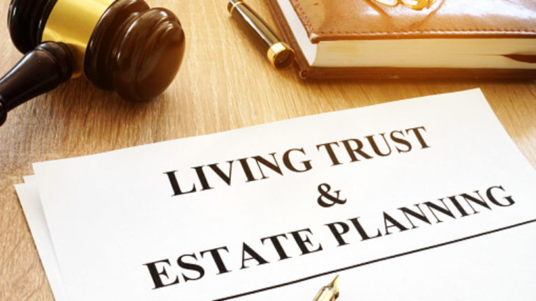 Living trust and estate planning form on a desk.